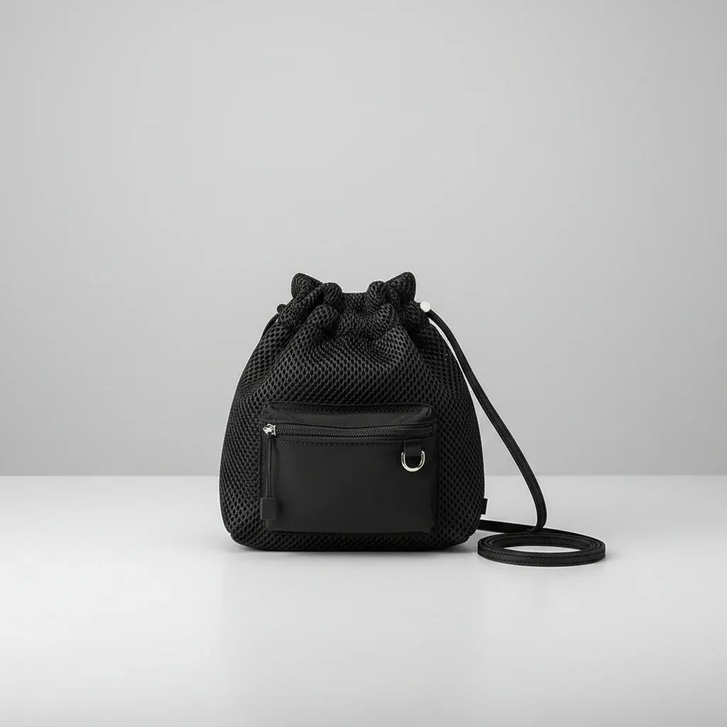 Black mesh drawstring side bag with front zip pocket on white surface