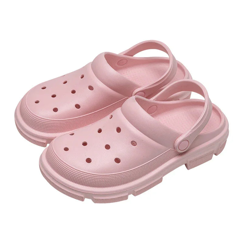 Light pink clogs with ventilation holes and heel straps, comfortable casual footwear