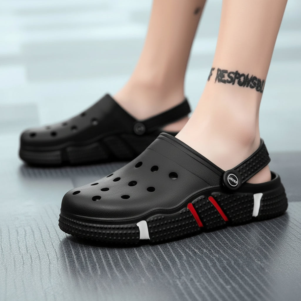 Black slip-on clogs with ventilation holes and red accent, sporty outdoor footwear