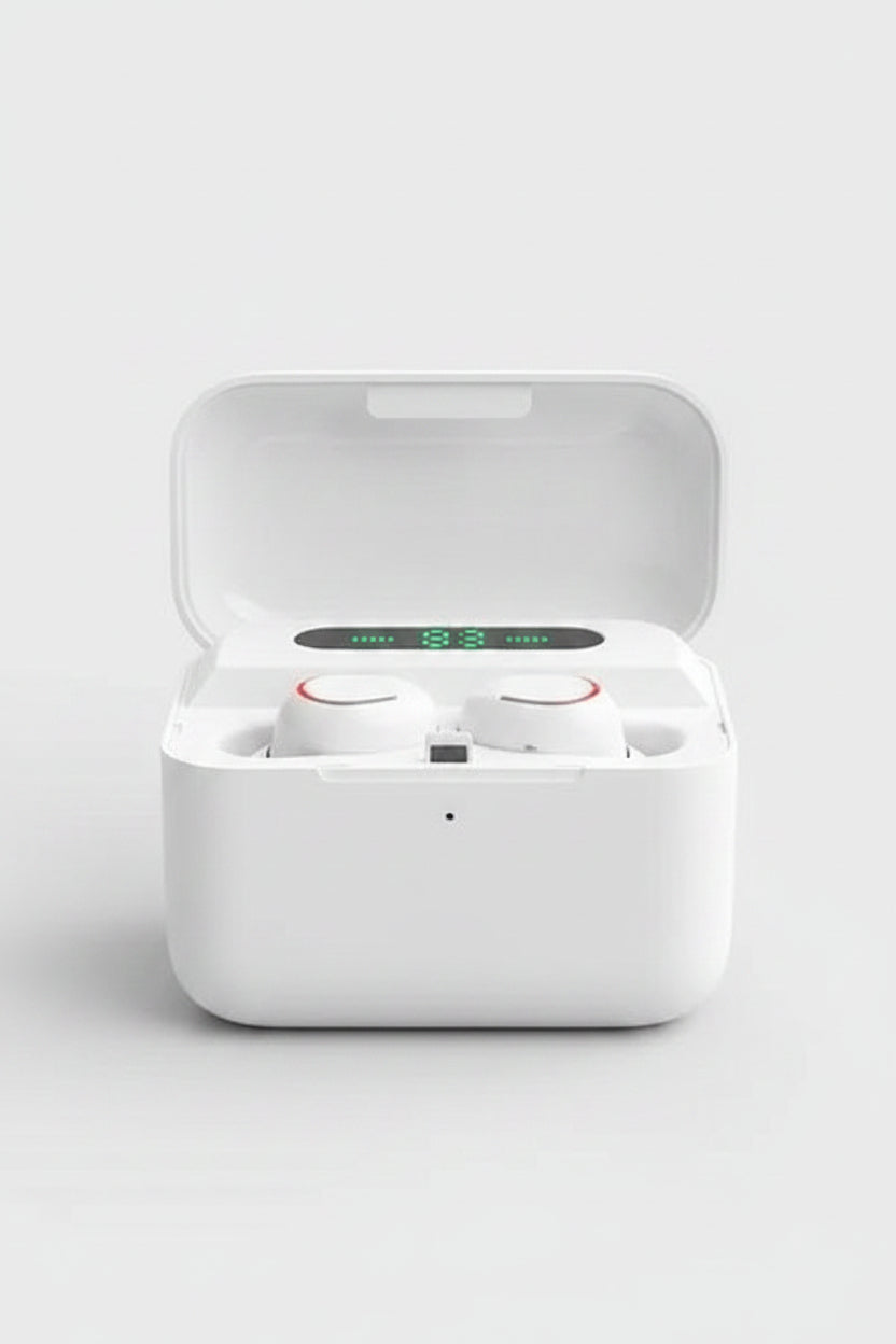 White wireless earbuds in charging case with LED display, keyboard in background