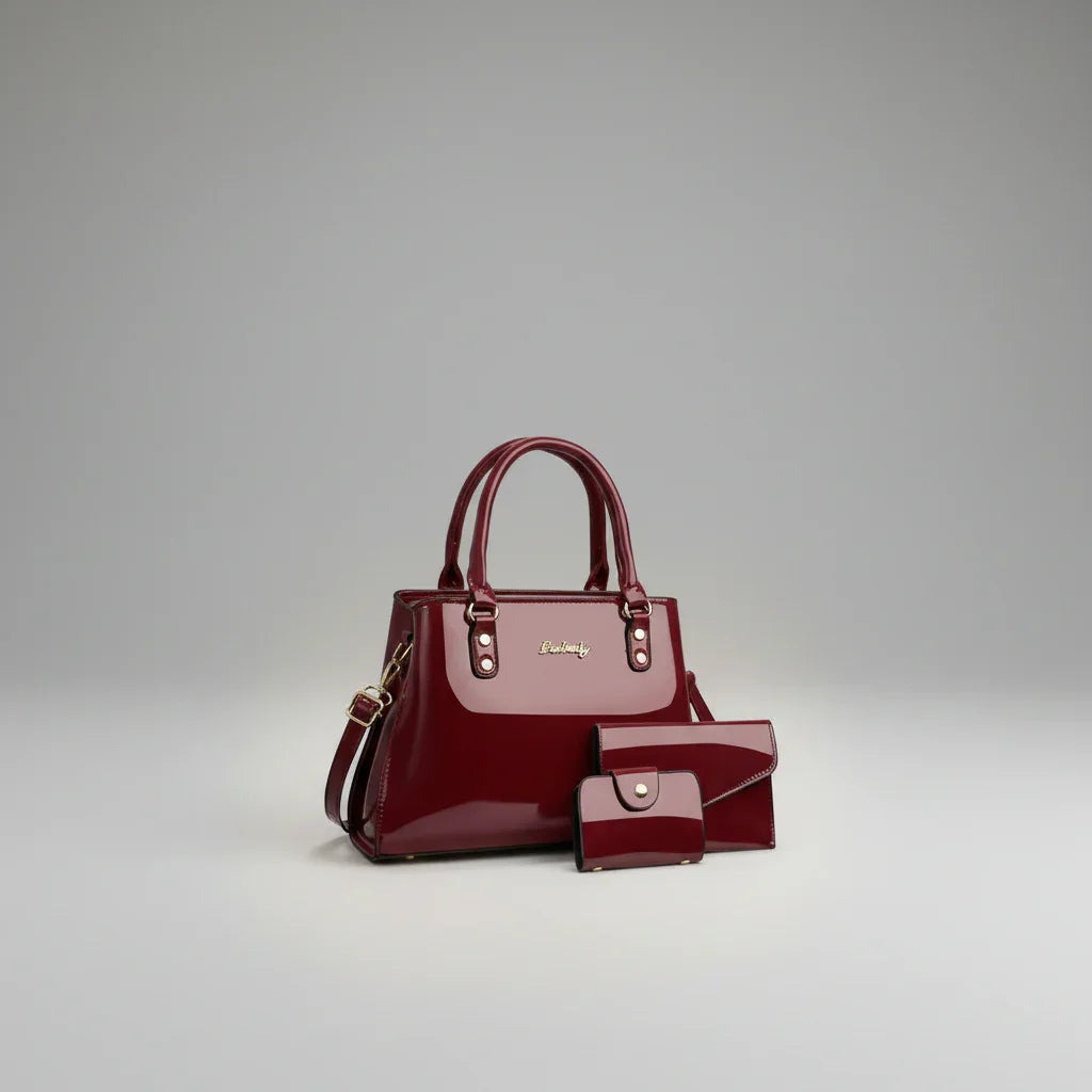 Maroon red women's patent leather shoulder bag with matching wallet and pouch set
