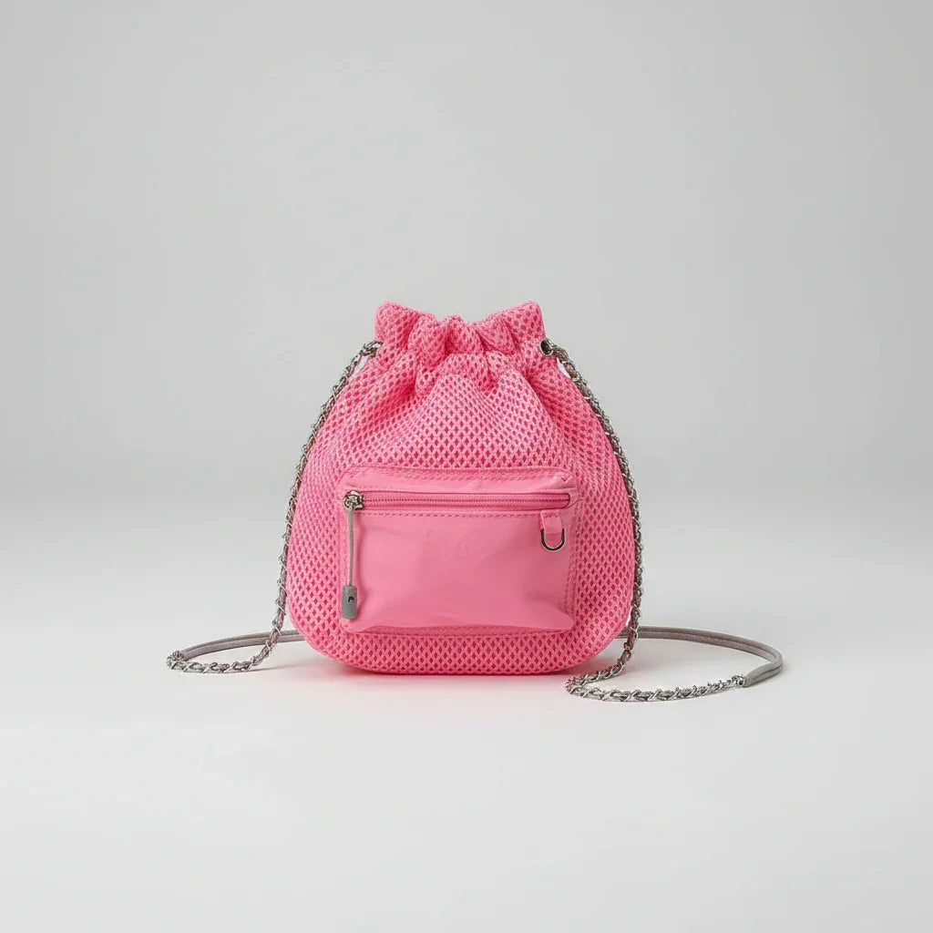 Pink mesh drawstring side bag with silver chain strap on plain background